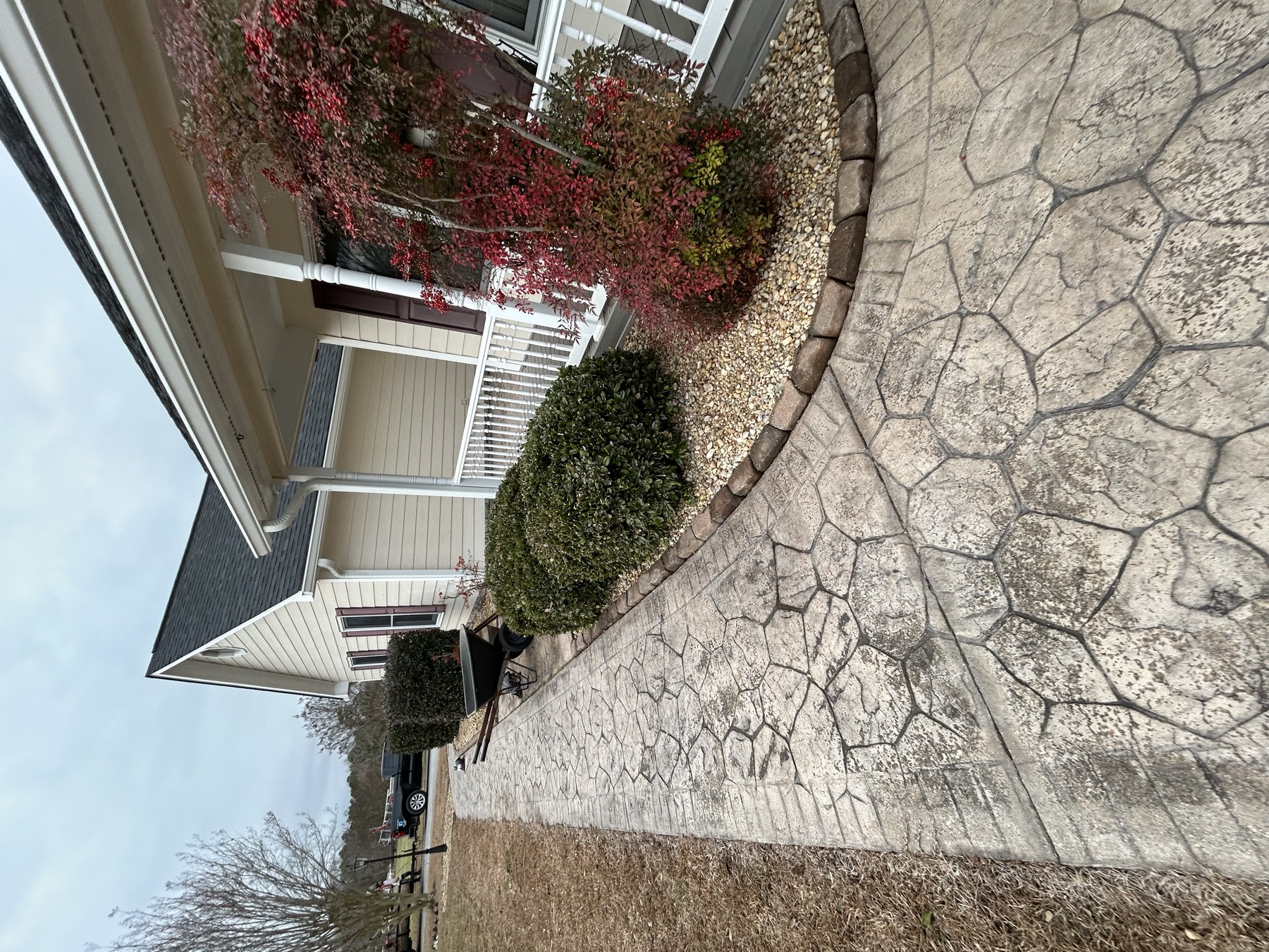 Fresh landscape install with stone walkway and mulch bed