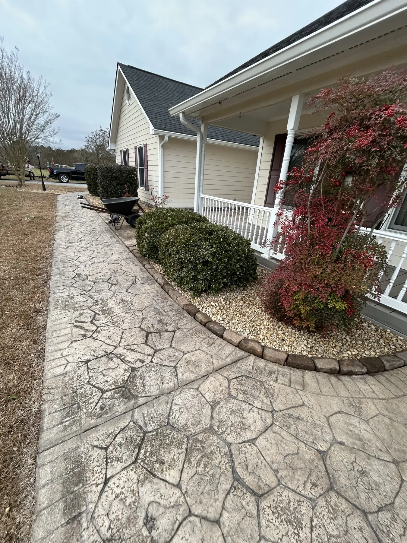 Fresh landscape install with stone walkway and mulch bed
